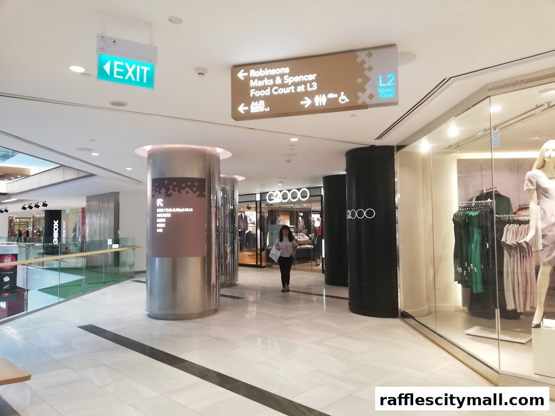 A shopping mall interior with an EXIT sign, directional signs, and the G2000 shop front.