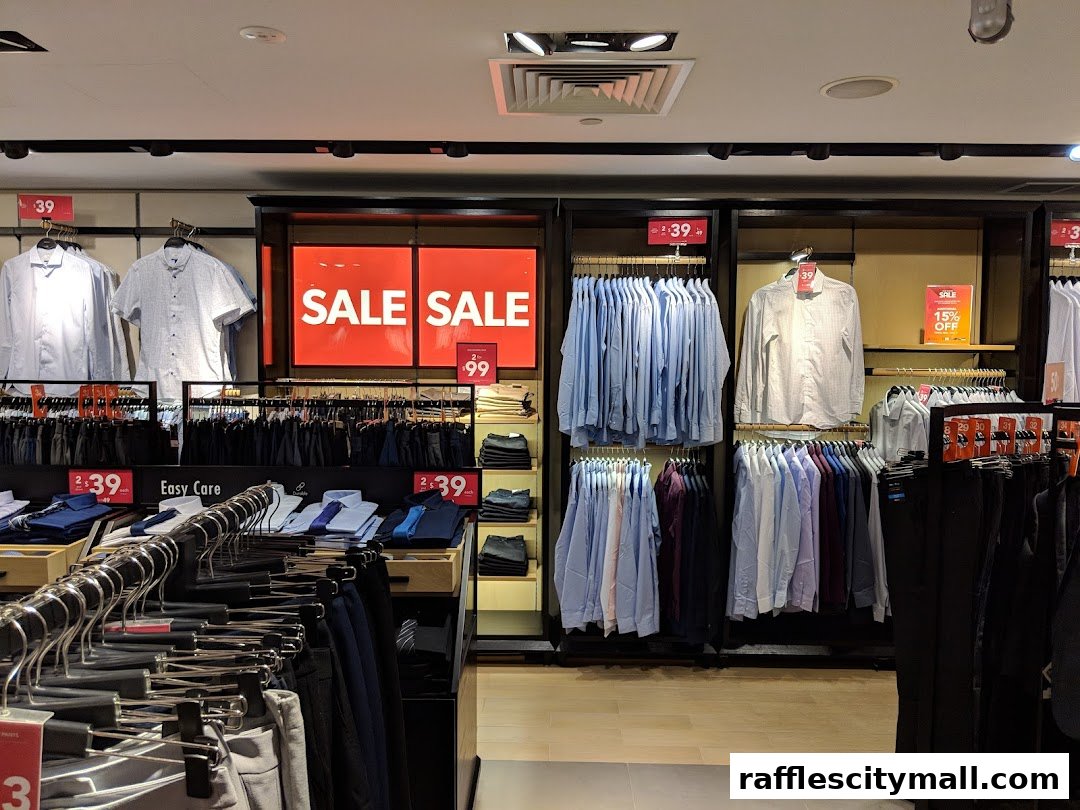 Interior view of a G2000 store showcasing a sale on men's shirts and trousers.