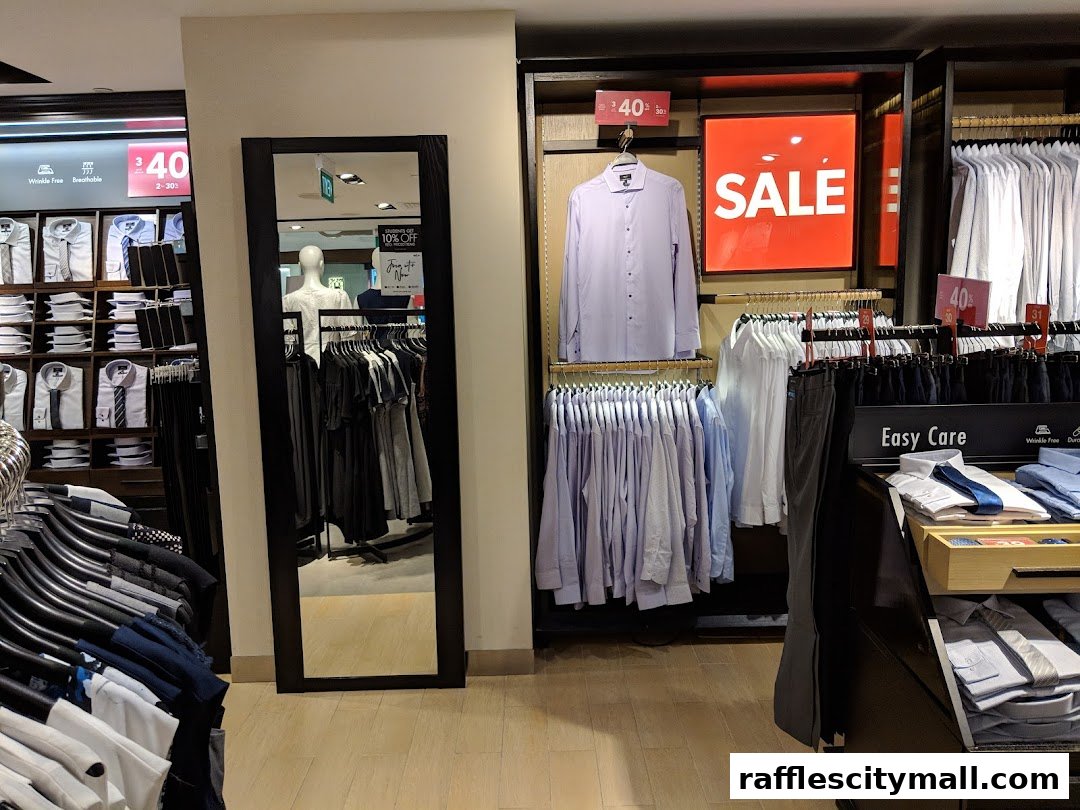 G2000 shop interior displaying men's shirts and trousers with a prominent sale sign.