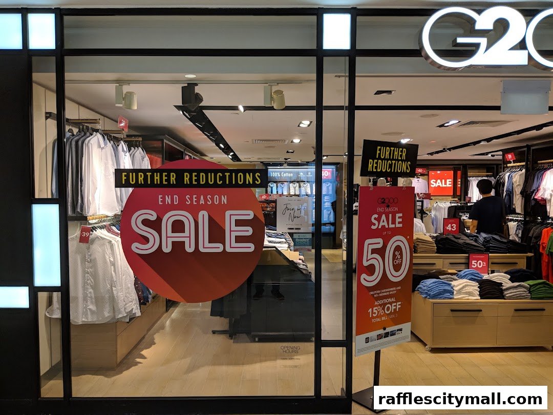 G2000 shop front with 'End Season Sale' signs and clothing displays.