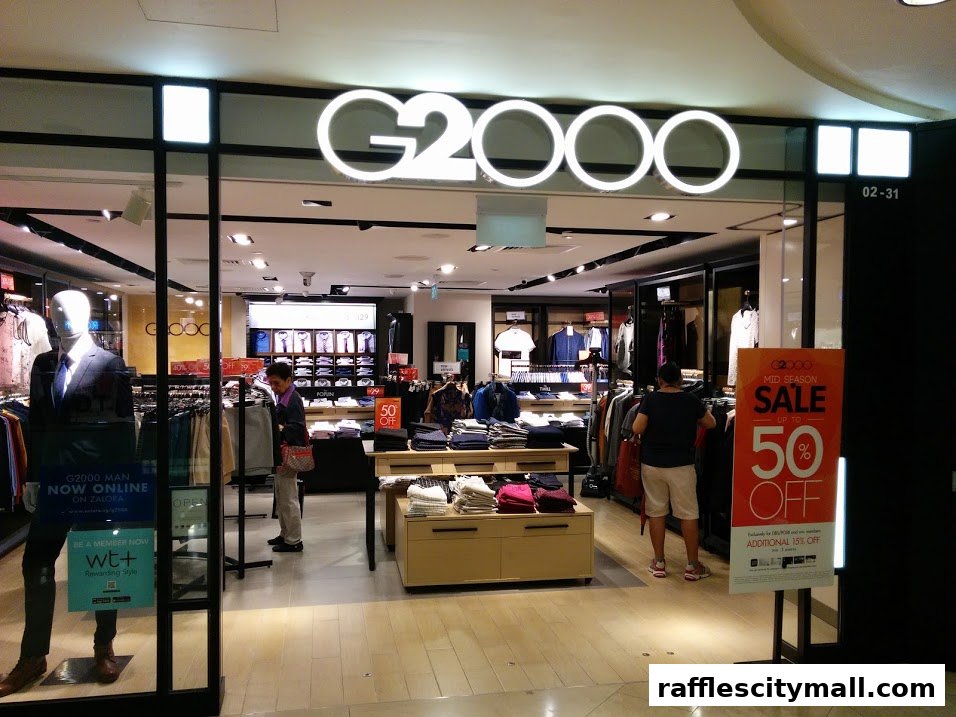 G2000 clothing store entrance with mannequins and a mid-season sale sign.