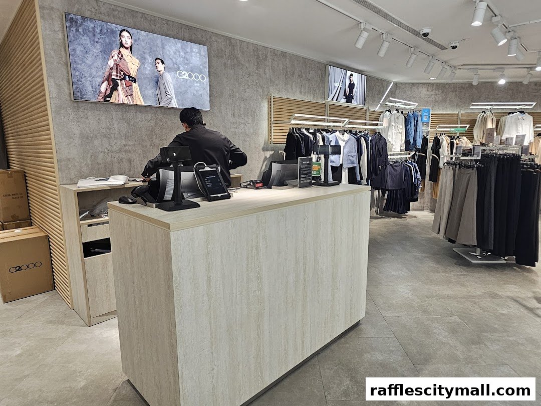 Interior of a G2000 clothing store with a cashier counter and racks of apparel.