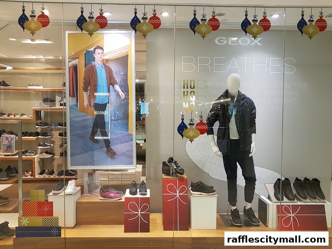 Geox store window display featuring a mannequin, shoes, and holiday decorations.