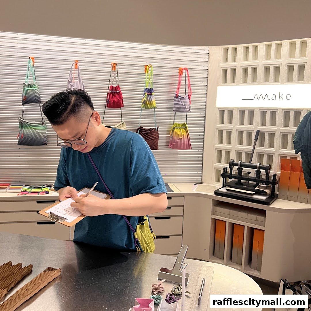 A man in a blue t-shirt writes on a clipboard in a store with colorful bags displayed.