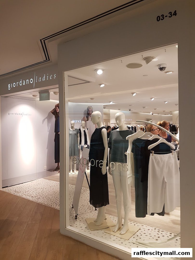 Giordano Ladies shop front with mannequins displaying elegant women's fashion.