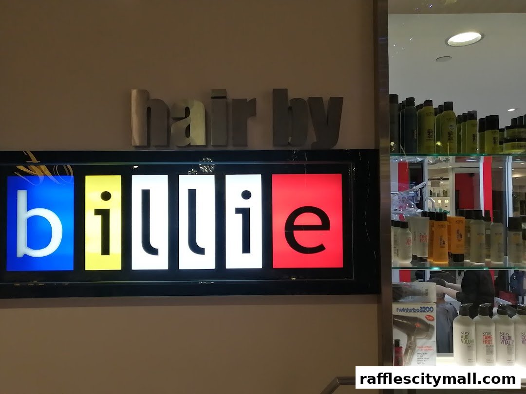 The 'Hair by Billie' salon sign with colorful letters and a display of hair products.