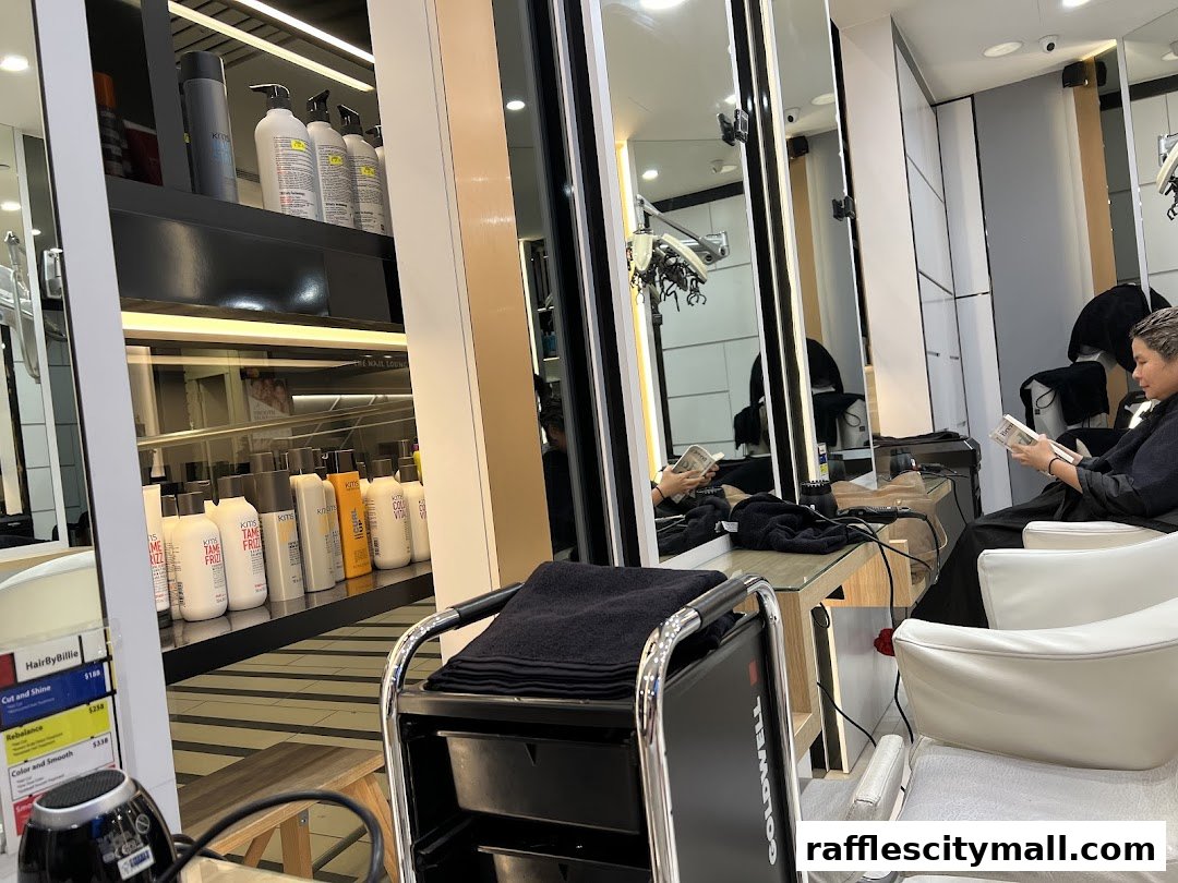 Interior of a hair salon with shelves of hair products and a client reading a magazine.