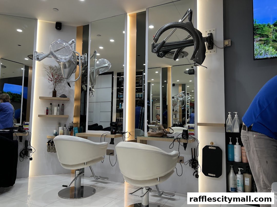 Interior of a modern hair salon with styling chairs, mirrors, and hair care products.