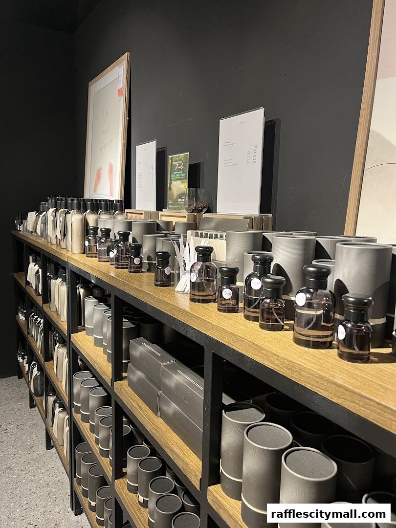 Shelves filled with various bottles and cylindrical containers, likely home fragrance products.