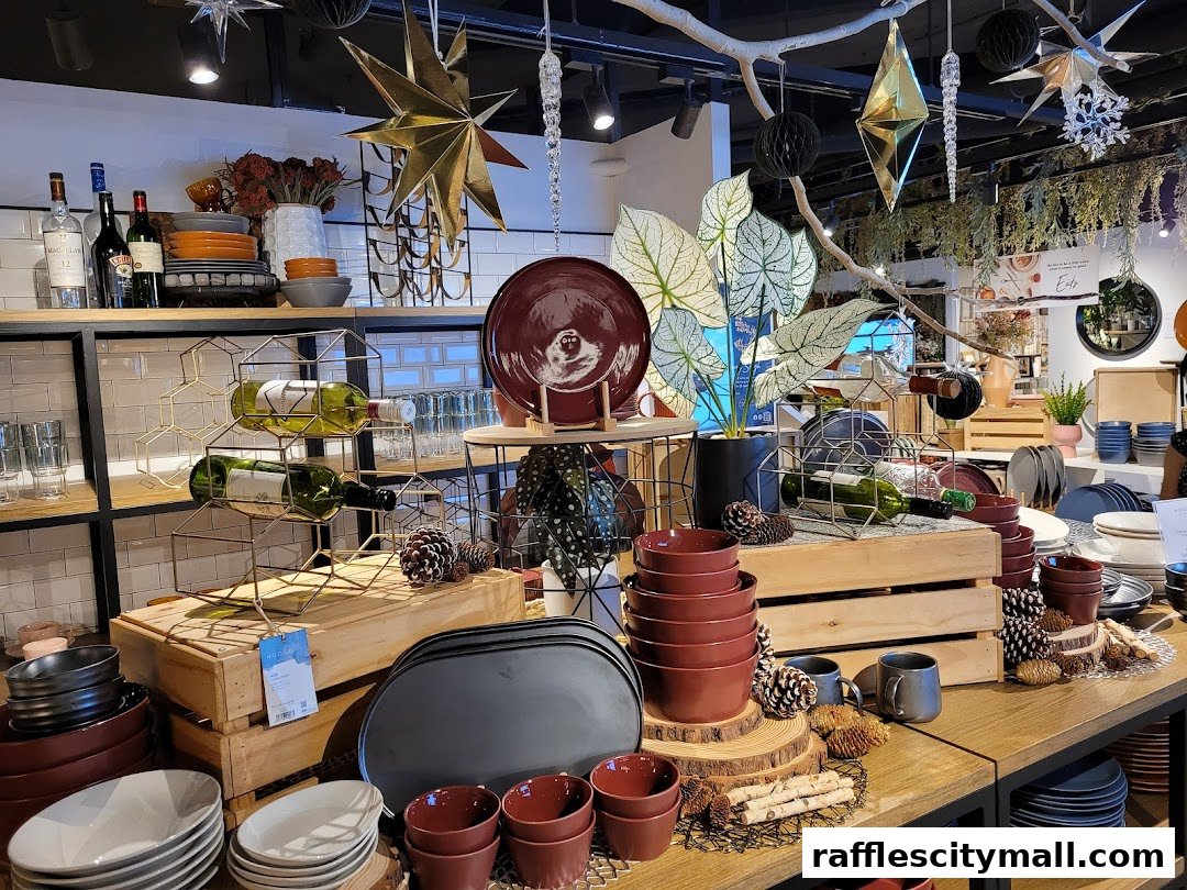 A display of homeware products including wine bottles, plates, bowls, and decorative items.
