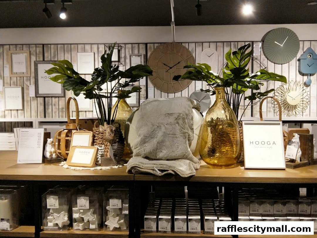 A display of home decor items including throws, vases, picture frames, and clocks.