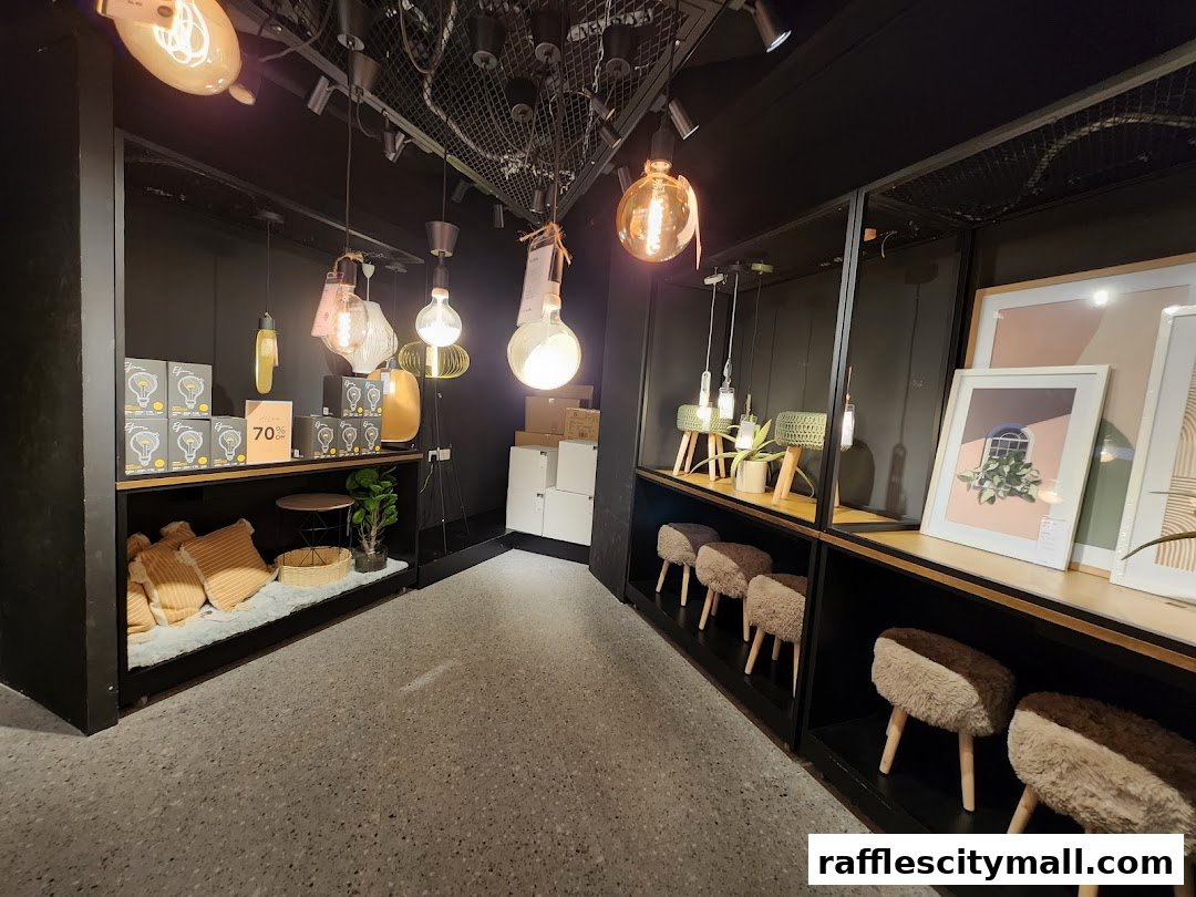 Interior view of a stylish home decor shop featuring lighting, cushions, and artwork.
