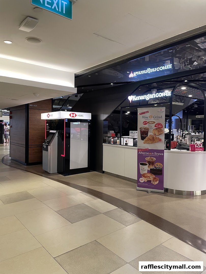 HSBC bank and Kenangan Coffee shop in a mall, with an ATM and promotional banners.