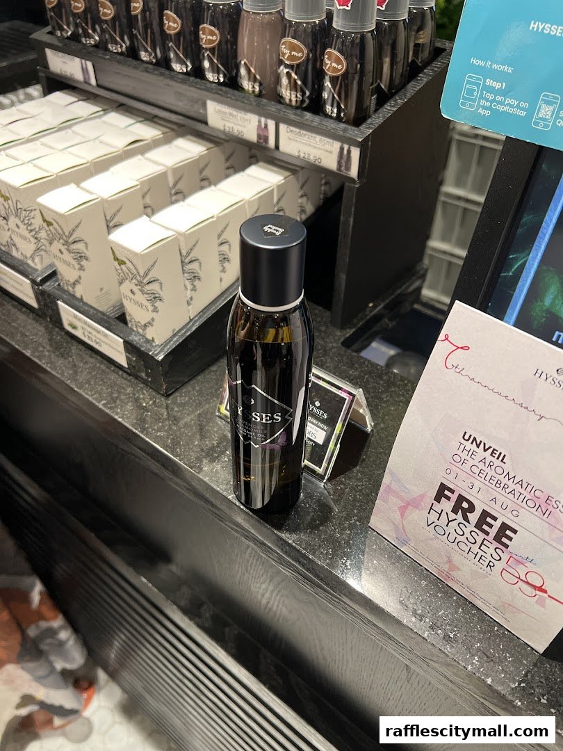 A display of HYSSES shampoo and conditioner bottles and boxes with promotional flyers.