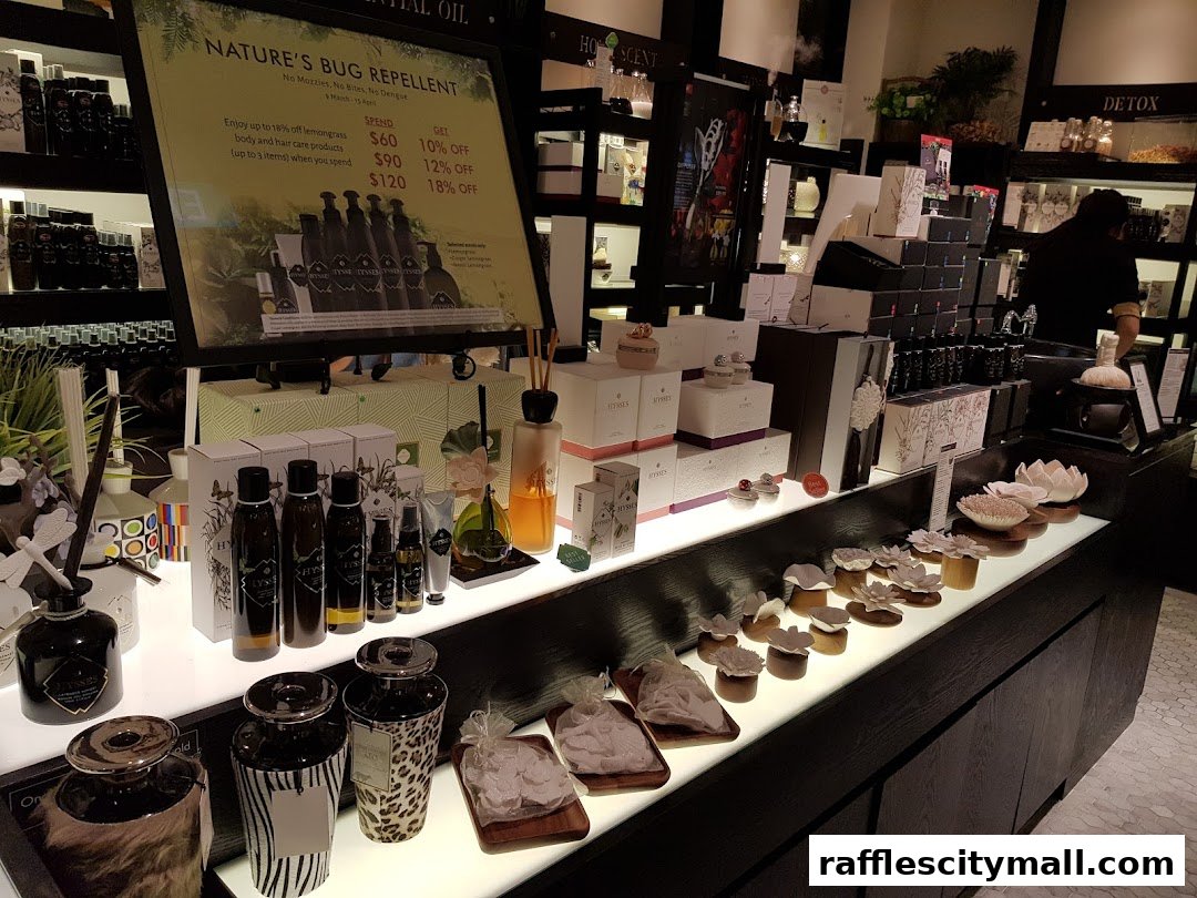 A retail shop display featuring various bottles, boxes, and decorative items, with a promotional sign for bug repellent.