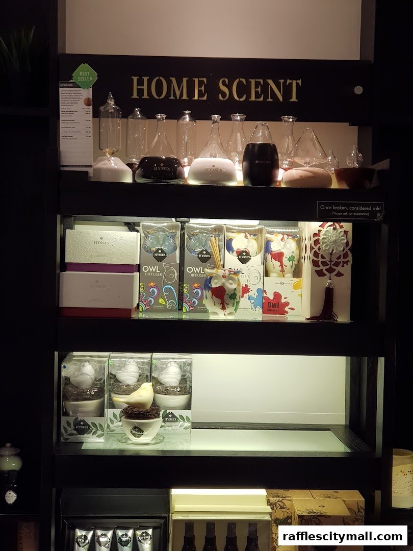 A display shelf showcasing various home scent products, including diffusers and decorative items.
