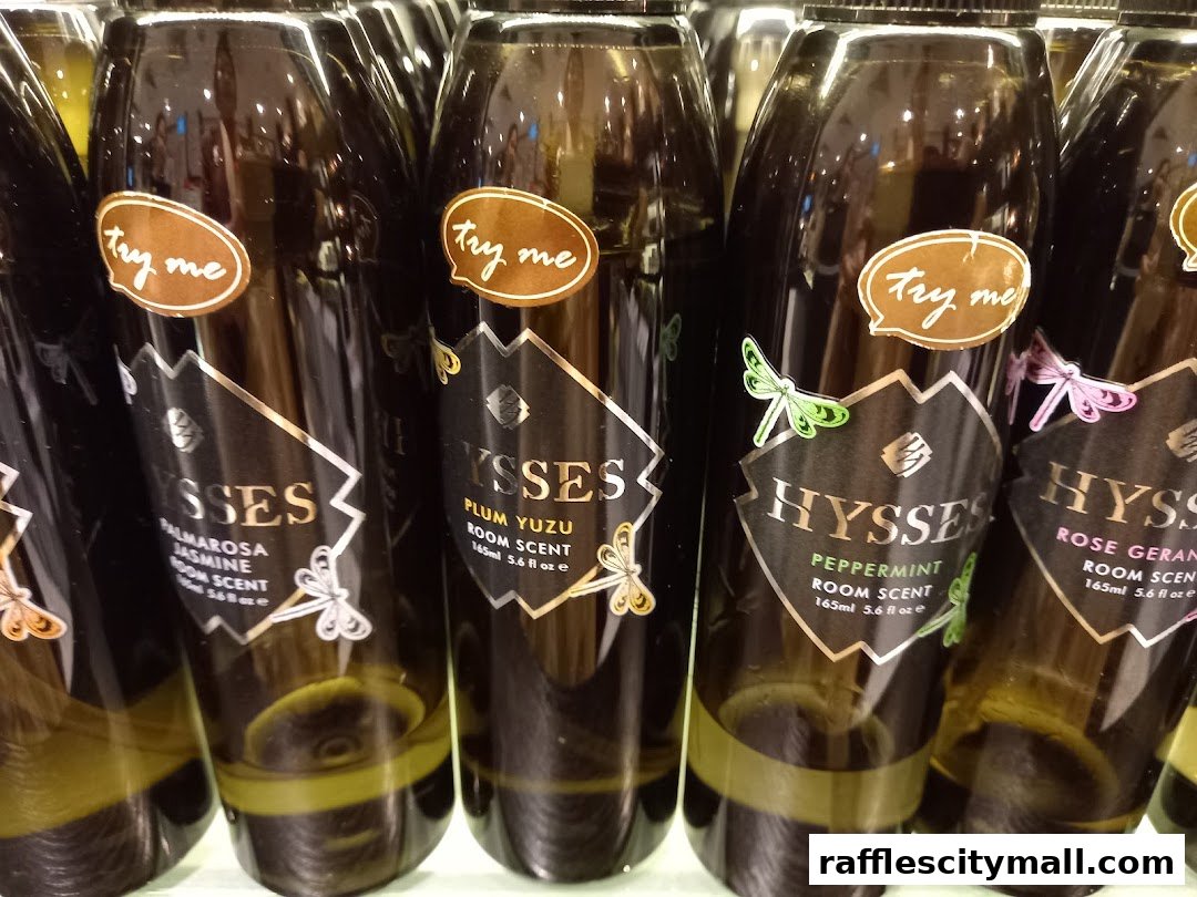 A close-up shot of several bottles of HYSSES room scent with 'Try me' tags.