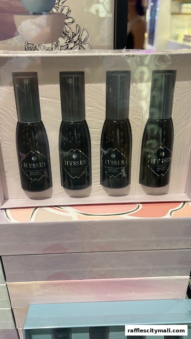 A gift set of four HYSSES room scents in dark glass bottles with spray tops.