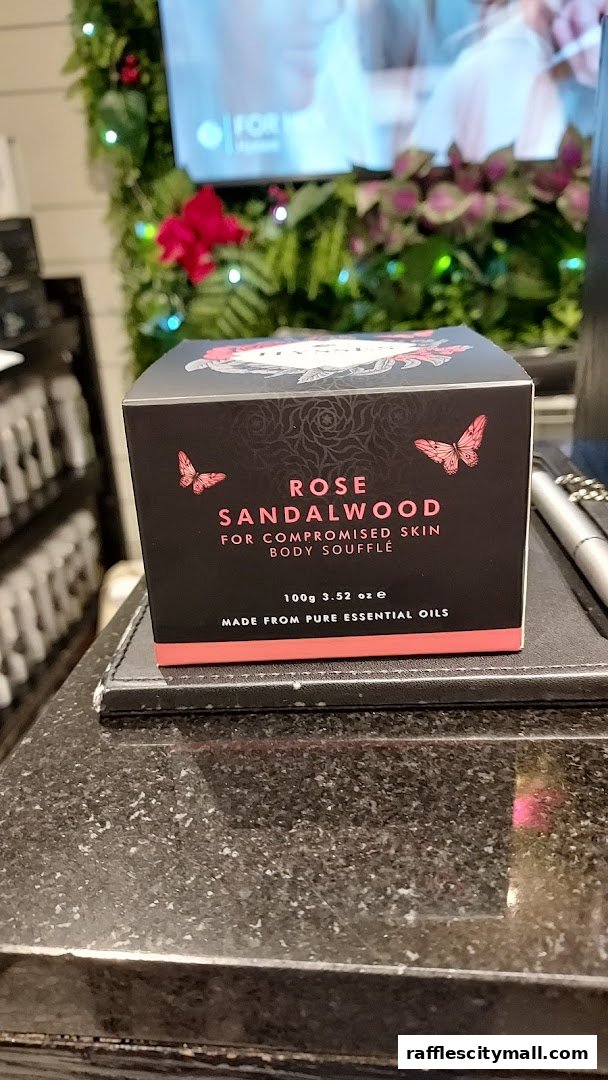 A box of HYSSES Rose Sandalwood Body Soufflé is displayed on a counter.