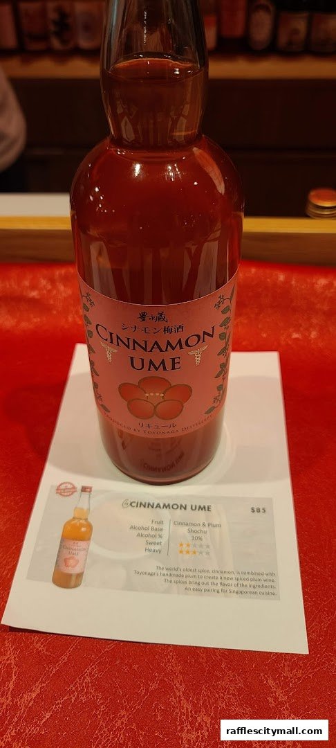 A bottle of Cinnamon Ume liqueur with a descriptive label and price displayed.