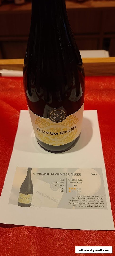 A bottle of Premium Ginger Yuzu sake is displayed with its product information.