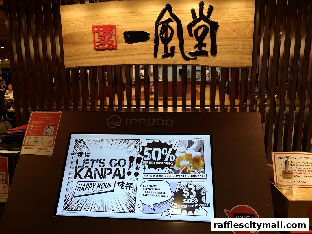 IPPUDO Raffles City features a digital display promoting happy hour deals and selected drinks.