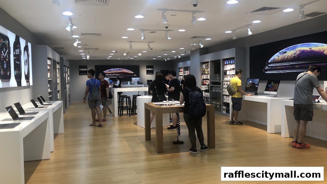 Customers browse Apple products in a modern, well-lit retail store.