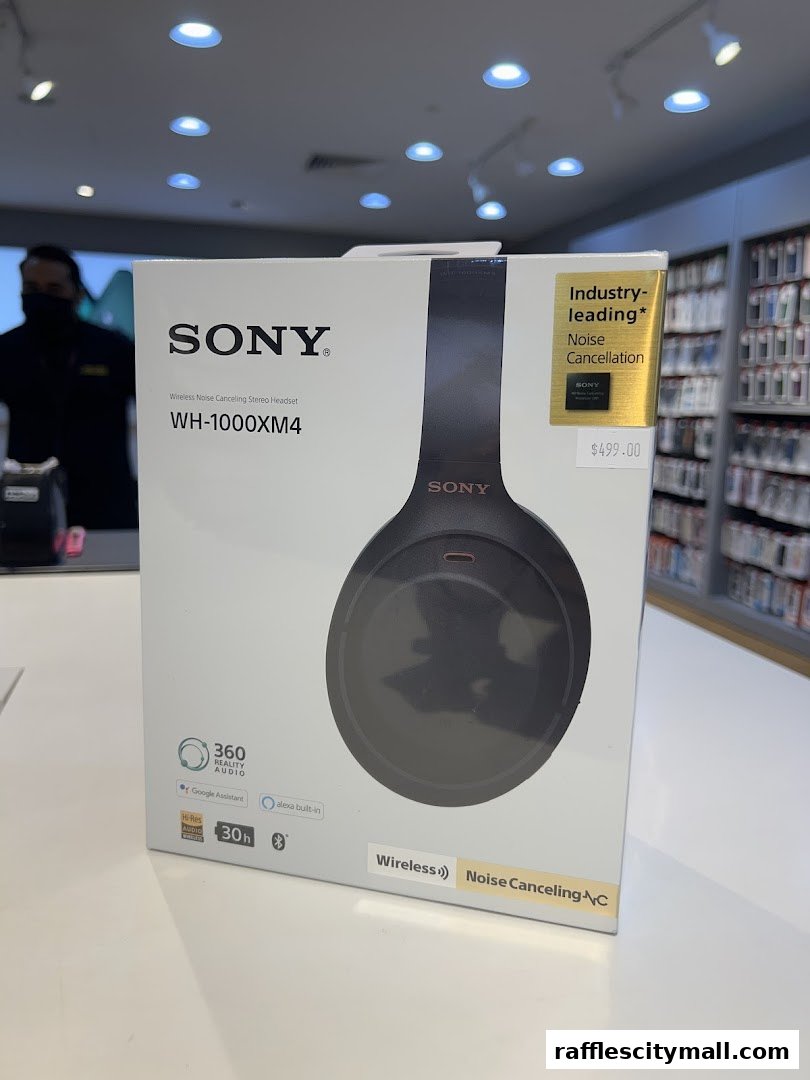 A box of Sony WH-1000XM4 wireless noise-canceling headphones is displayed.