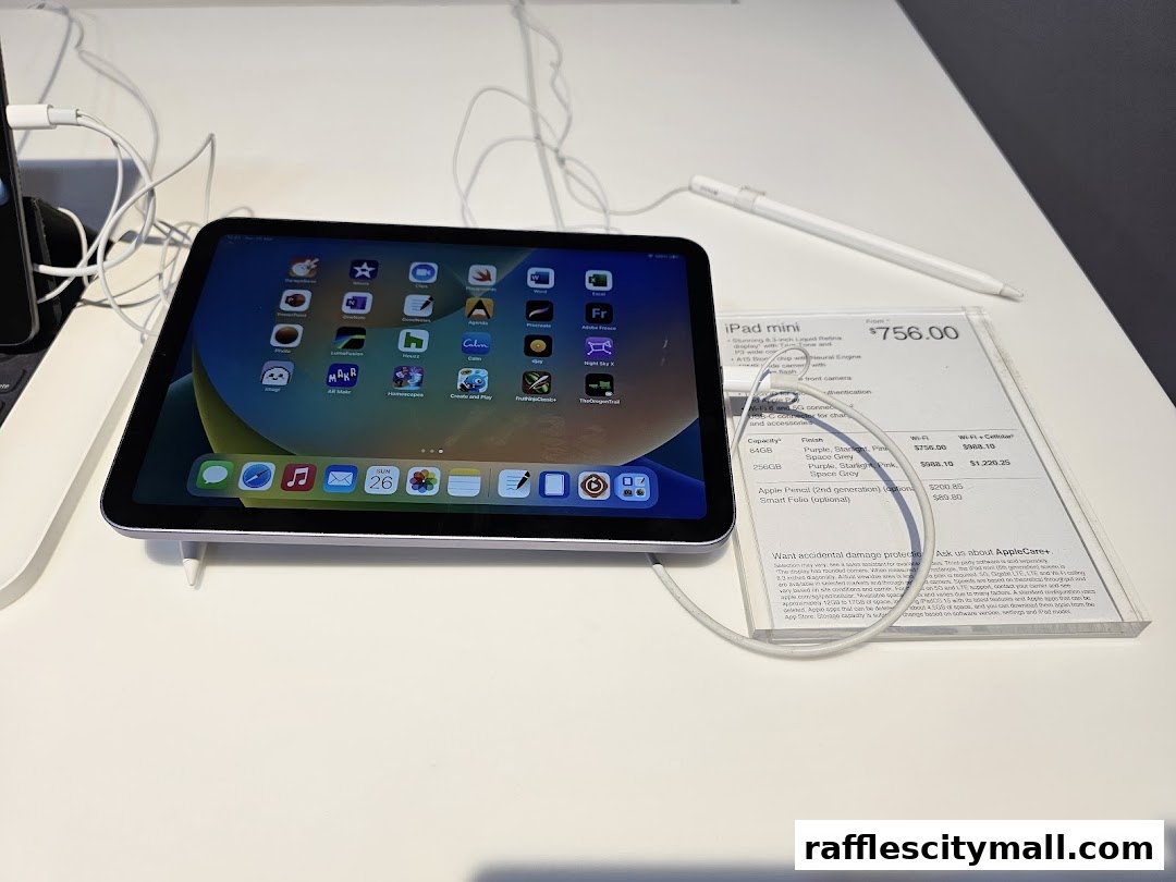 An iPad mini with an Apple Pencil displayed on a white surface with product information.