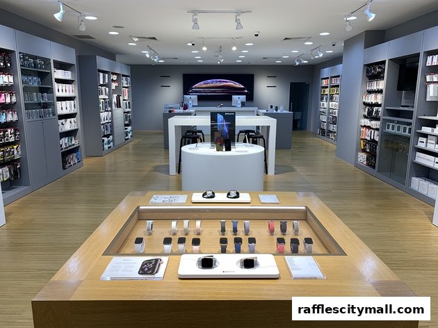 Interior view of an iStudio store showcasing Apple products, including Apple Watches and iPhones.