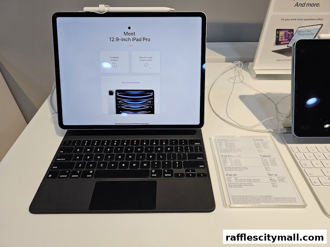 A display of Apple iPads and accessories, featuring the 12.9-inch iPad Pro with a keyboard.
