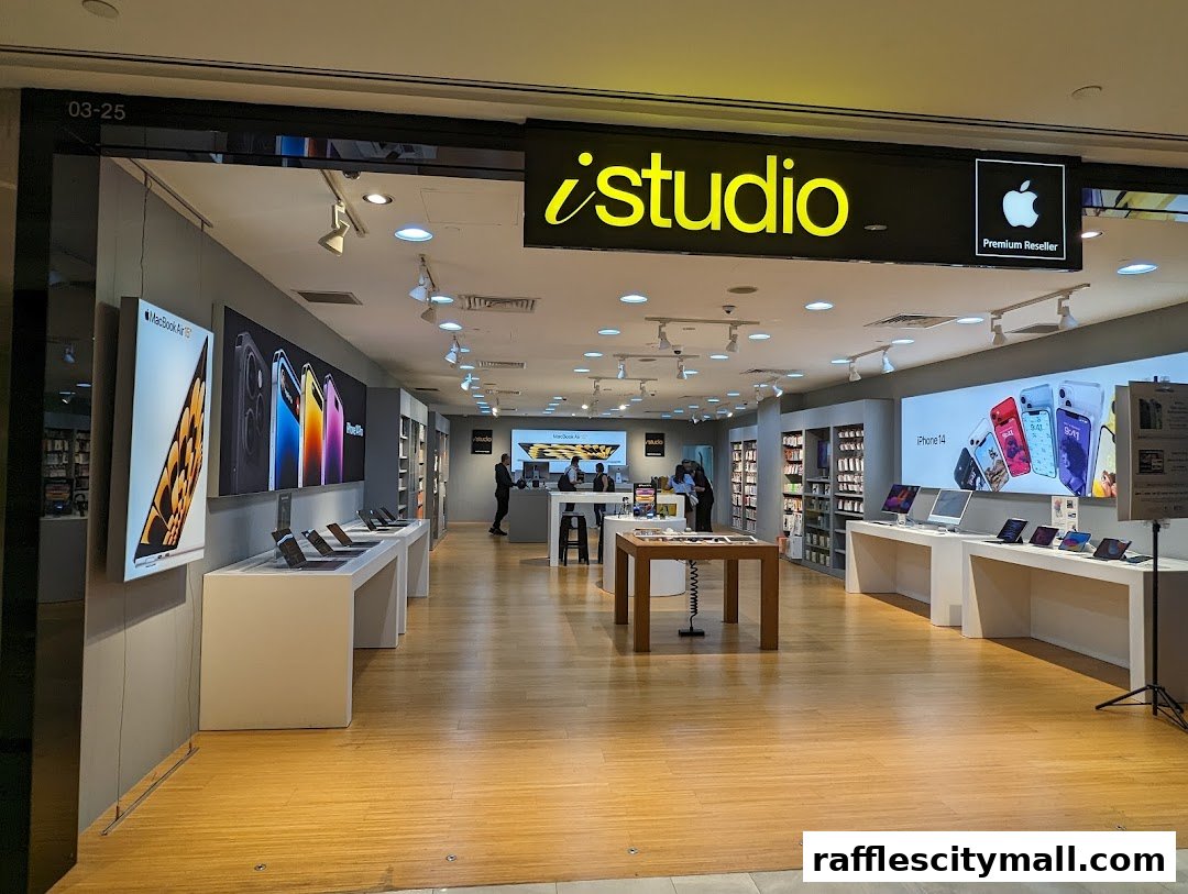 The interior of an iStudio store, showcasing Apple products and displays.