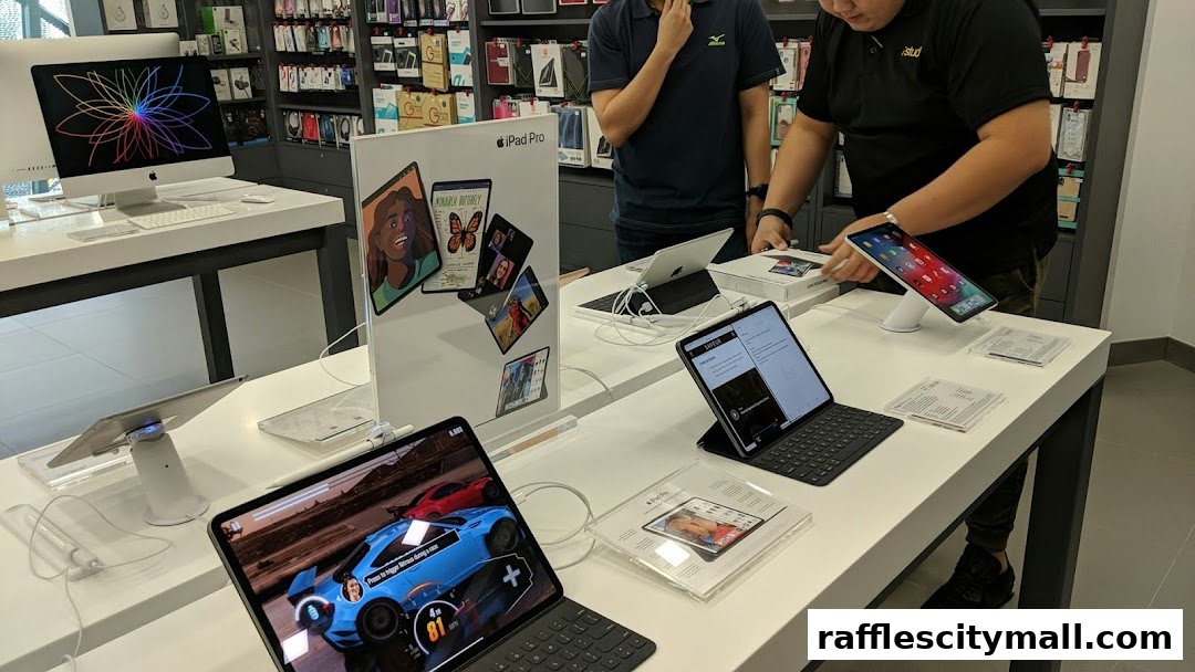 Customers exploring the latest Apple iPads and iMacs at an iStudio store.
