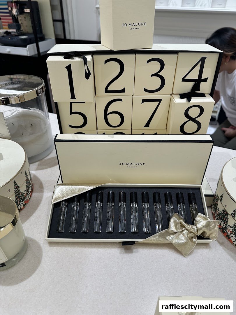 Jo Malone London advent calendar and perfume samples displayed on a table.