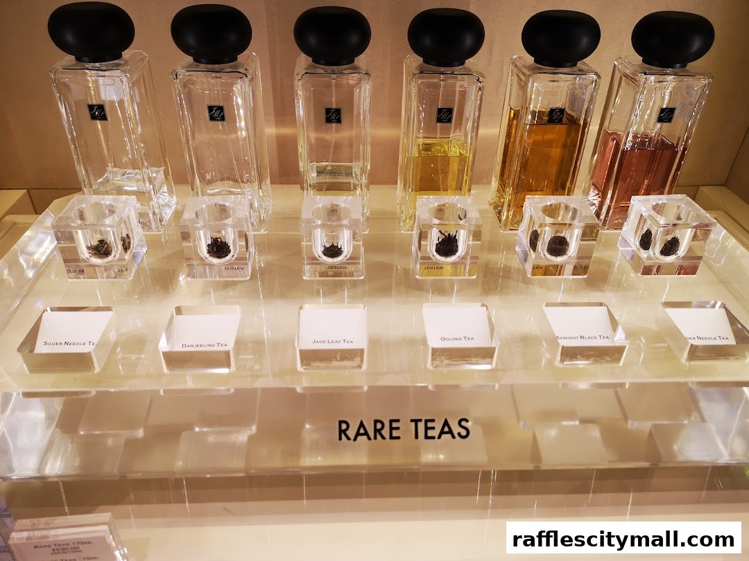 Jo Malone London display of 'Rare Teas' fragrances with tea leaf samples.