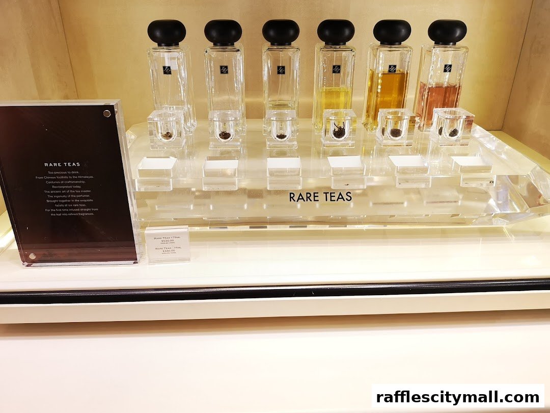 Jo Malone London display featuring 'Rare Teas' collection with perfume bottles and tea samples.