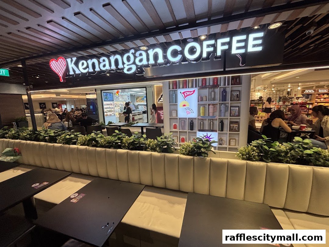 Interior view of Kenangan Coffee shop with seating and display shelves.