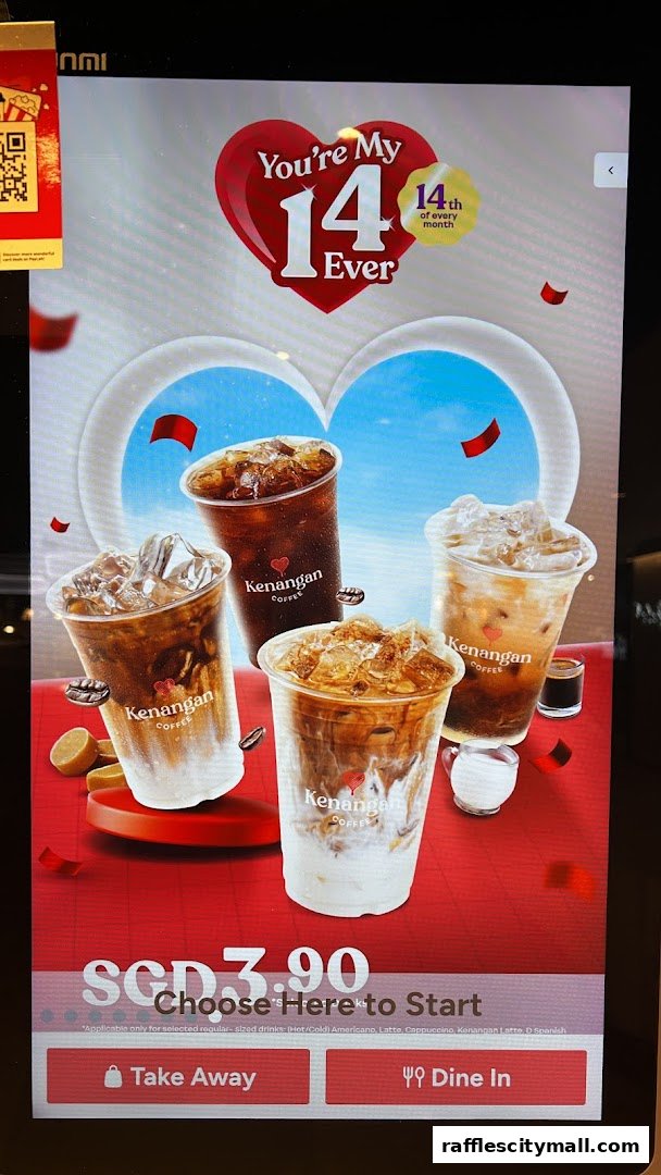 A digital display showcasing iced coffee drinks from Kenangan Coffee with a Valentine's Day theme.