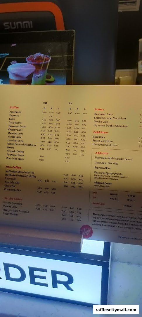 A menu from Kenangan Coffee Raffles City displaying various coffee and non-coffee beverages with prices.