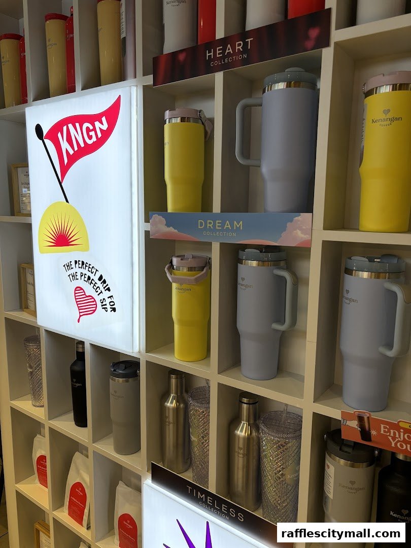 Shelves display various Kenangan Coffee tumblers, bottles, and coffee bags, with collection labels.