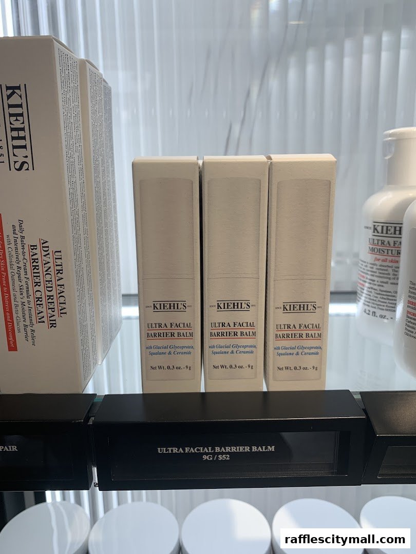 Kiehl's Ultra Facial Barrier Balm products displayed on a shelf with pricing information.