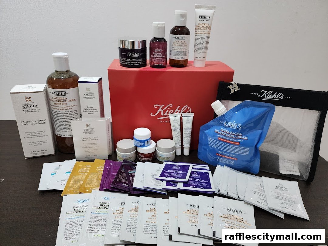 A collection of Kiehl's skincare products, including toners, serums, creams, and sample packets.