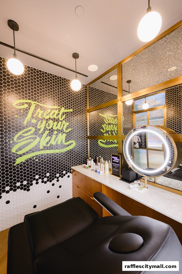 A modern skincare treatment room with a comfortable chair, illuminated mirror, and product display.