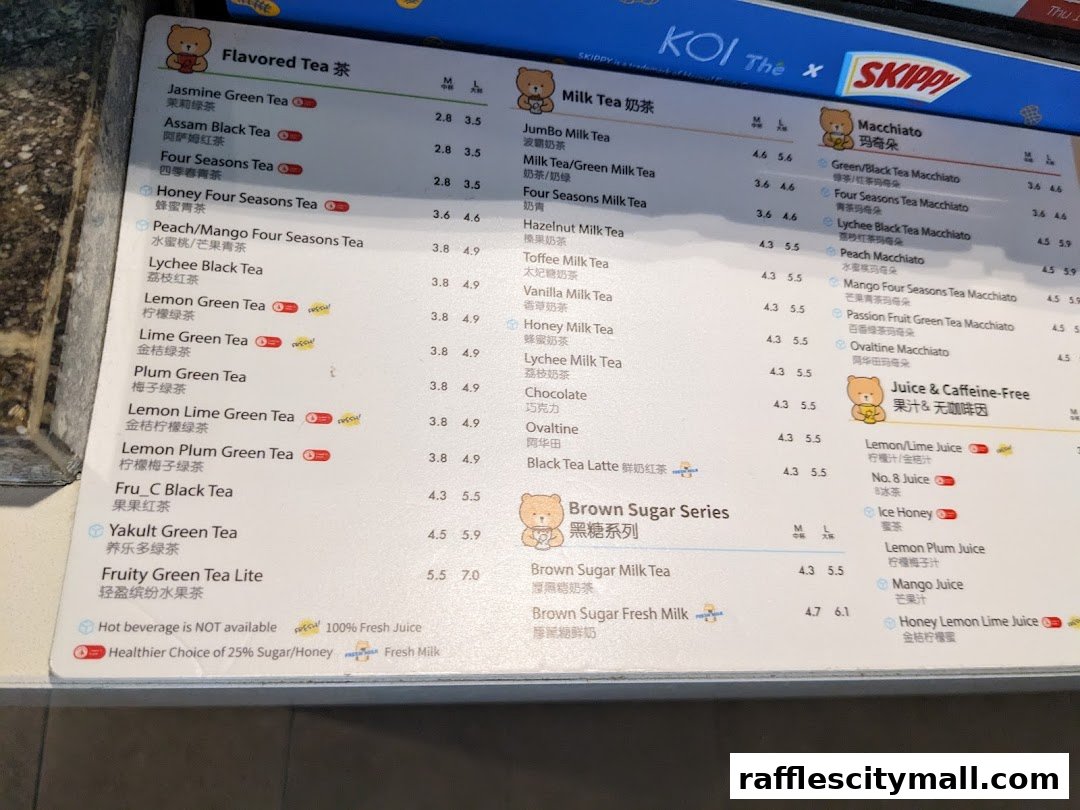 A menu board for KOI The featuring various milk teas, macchiatos, and juices.