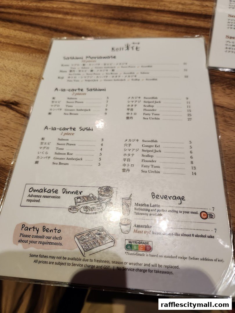A menu from Koji Sushi Bar featuring sashimi, sushi, omakase dinner, party bento, and beverages.