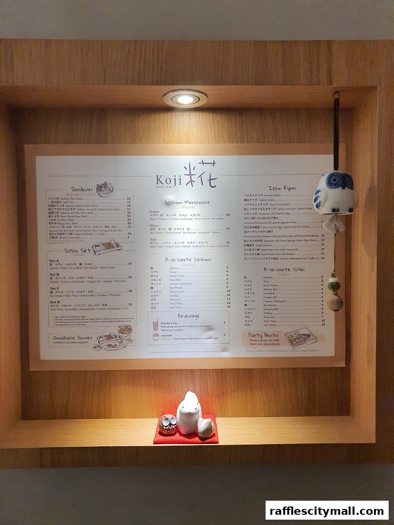 A menu for Koji Sushi Bar featuring Donburi, Sashimi, Sushi Sets, and Beverages.