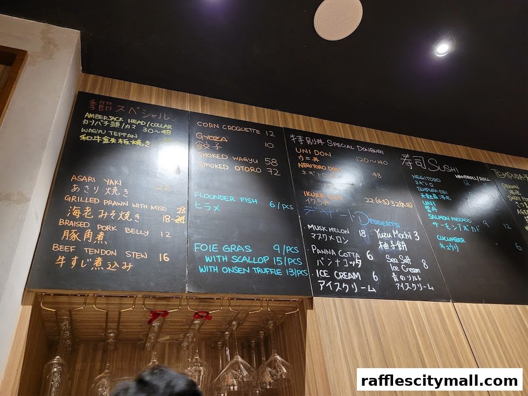 A chalk menu board displaying various Japanese dishes and desserts with prices.