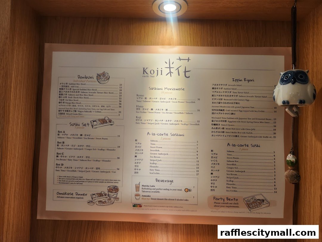 A menu for Koji Sushi Bar featuring various sushi sets, sashimi, and individual dishes.