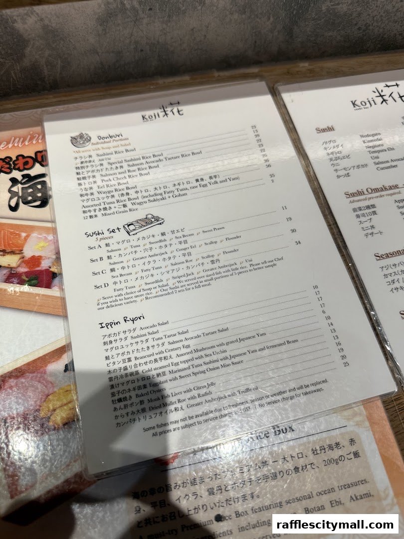 A close-up view of a Japanese restaurant's menu, showcasing sushi and donburi options.