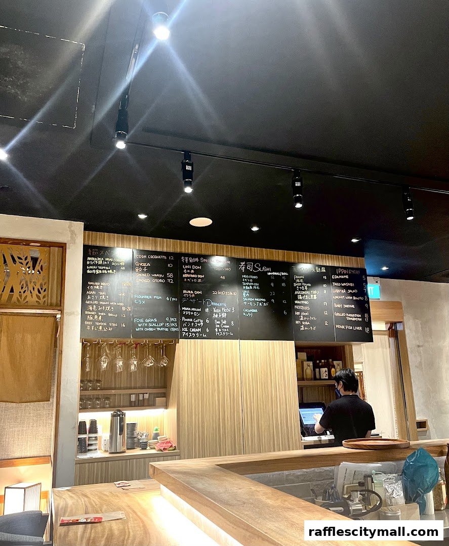 A menu board displaying various sushi and Japanese dishes with prices at Koji Sushi Bar.